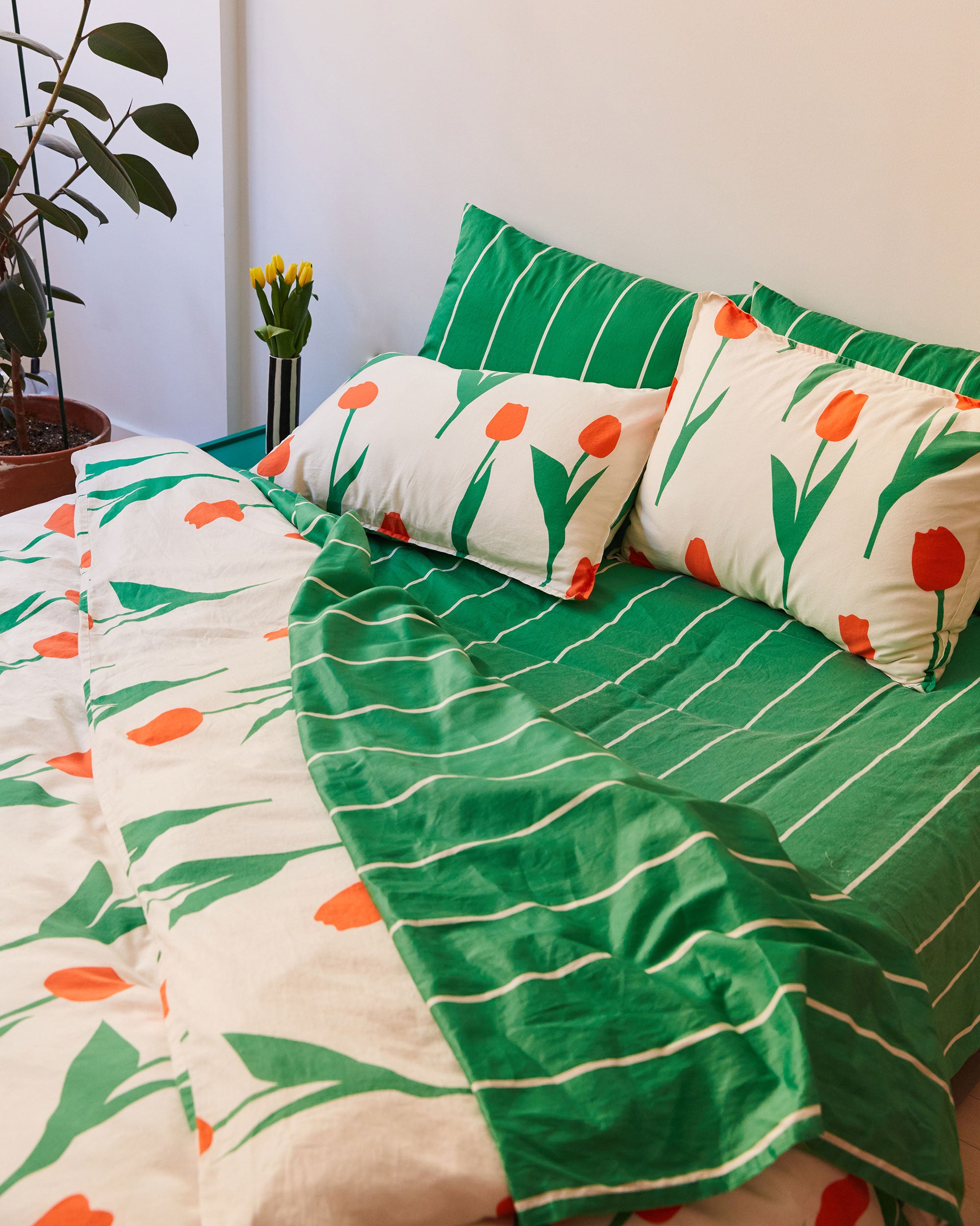 Dusen Dusen green pinstripe sheets with red tulip duvet cover and pillowcases