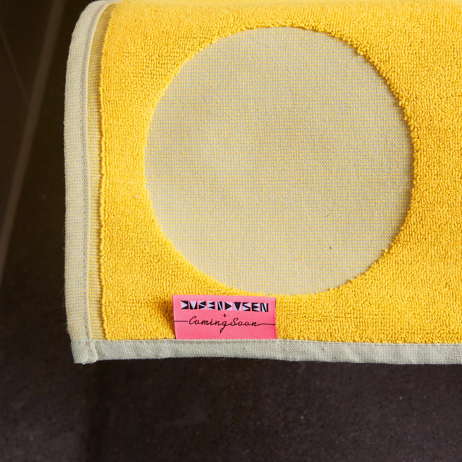 detail of pink tag with yellow dot curtain
