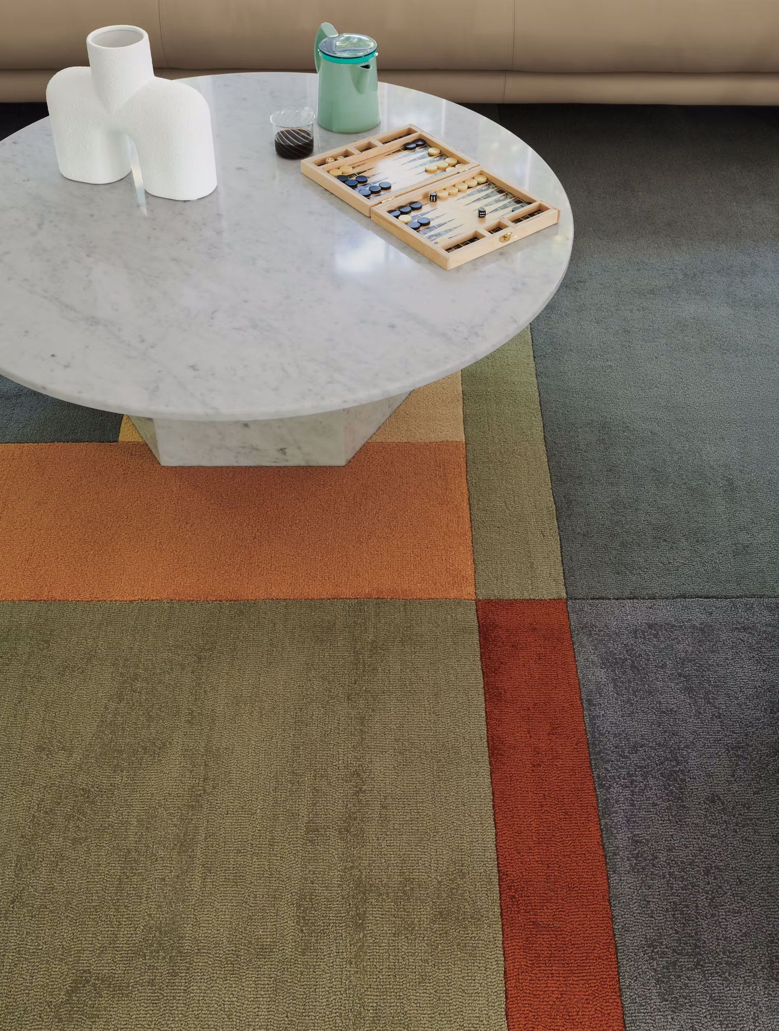 landscape rug under marble table