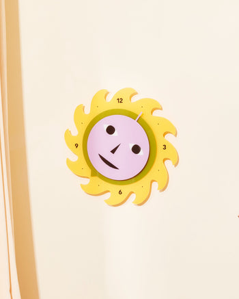 Everybody Clock made in collaboration with Areaware. Made in Purple, Green and Yellow or Yellow, Red and Blue. Battery powered (not included). Recycled acrylic, clock mechanism, plastic. Made in China.