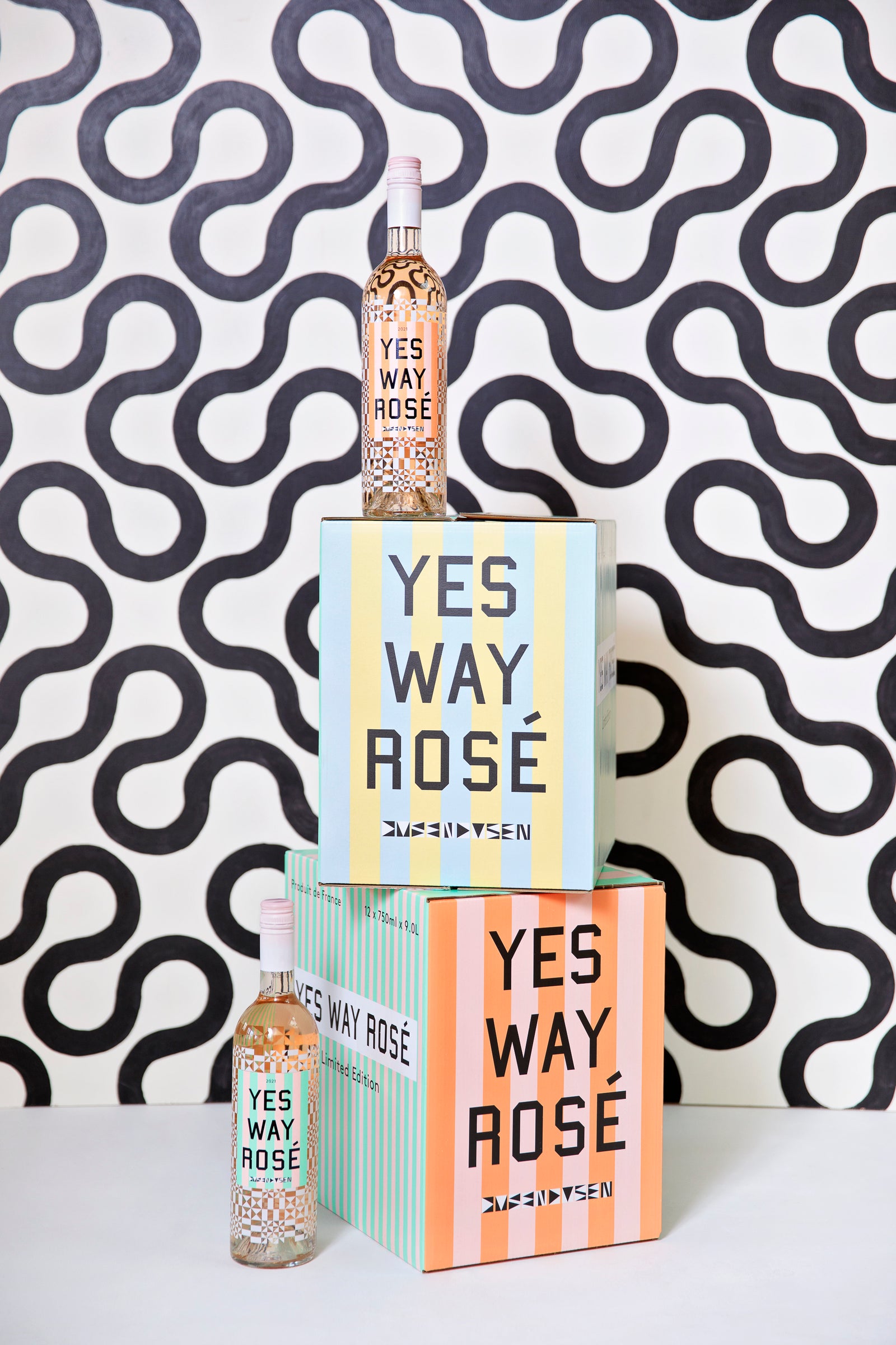 boxes of yes way rose with pattern and two bottles