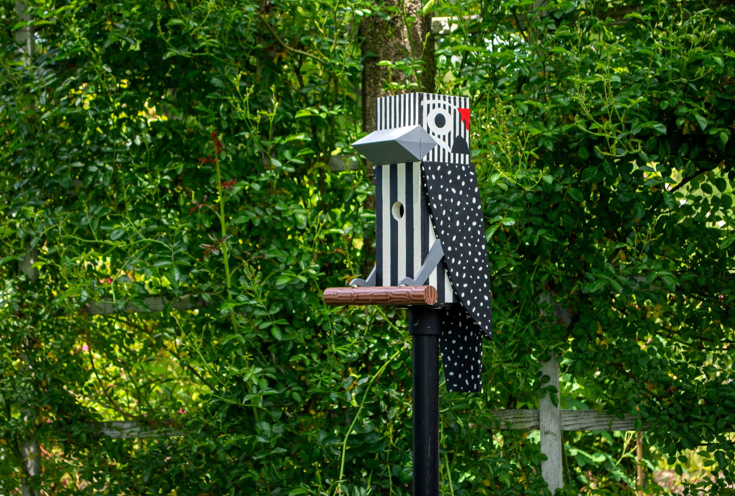woodpecker birdhouse on perch