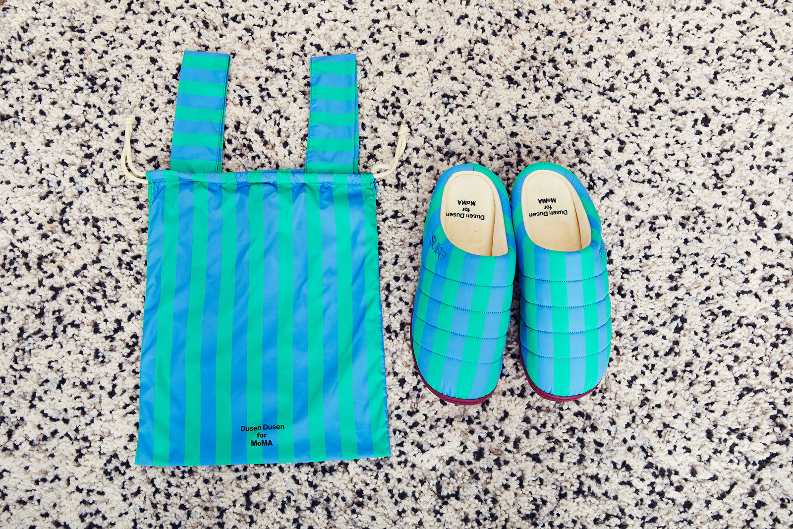 green and blue stripe slipeprs with bag