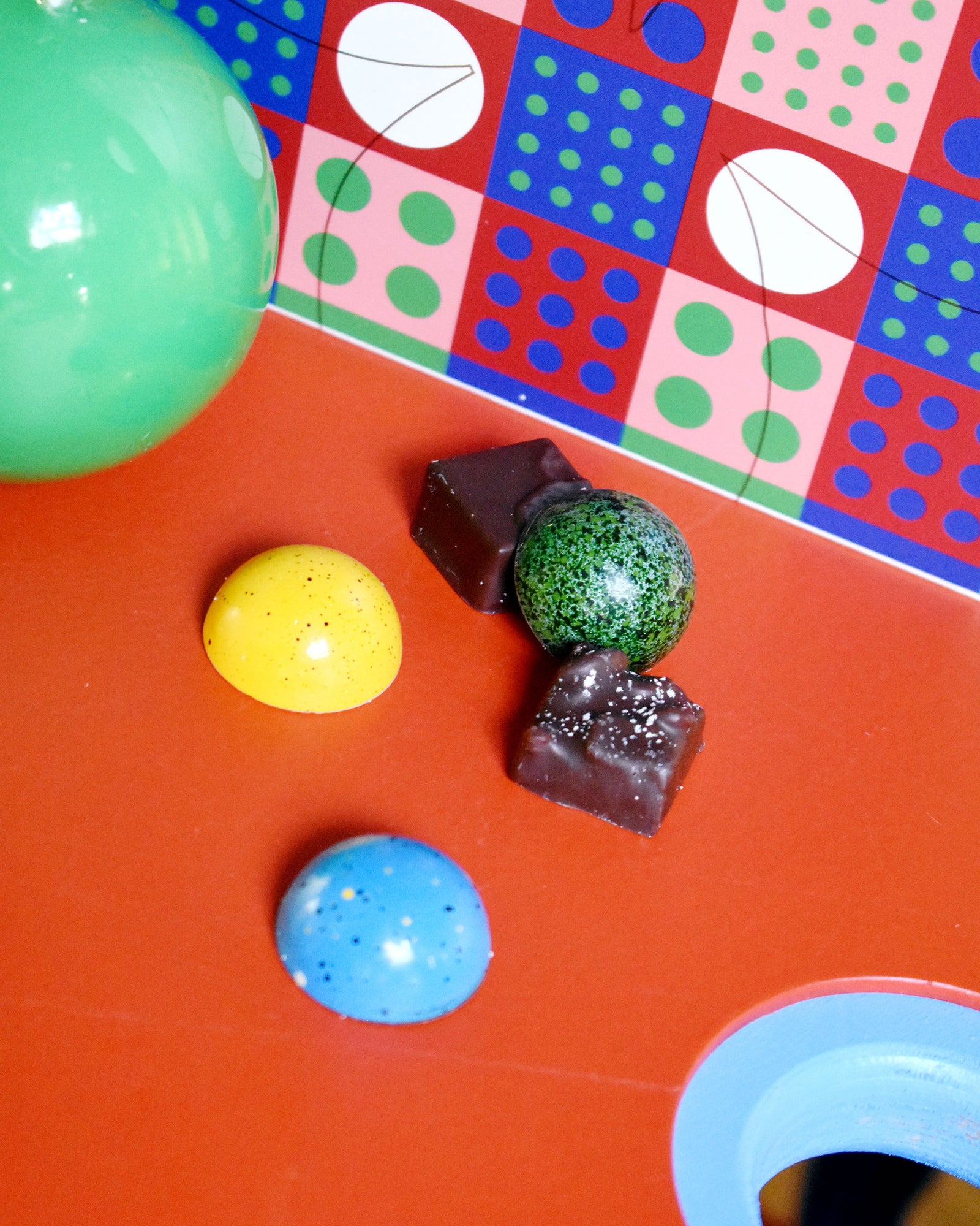 detail of chocolates on red table
