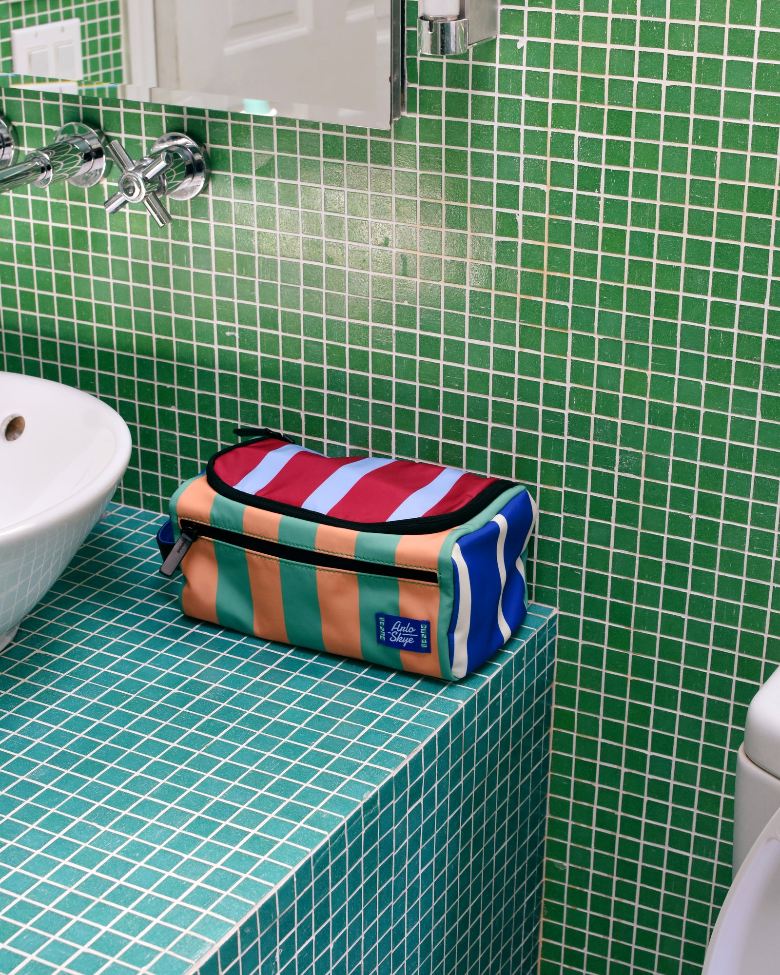 dop kit in multicolored green tile counter