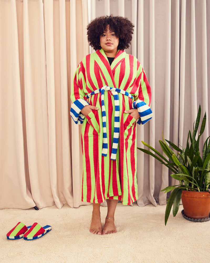 Bathrobe in Garden Stripe. Cotton terry bathrobe with shawl collar, patch pockets, and tie. Contrasting stripes and colorways on both sides. 95% cotton terry, 5% polyamide, 430 GSM. This item is Oeko-Tex Standard 100 certified (no harmful chemicals were used during production). Made in Portugal.