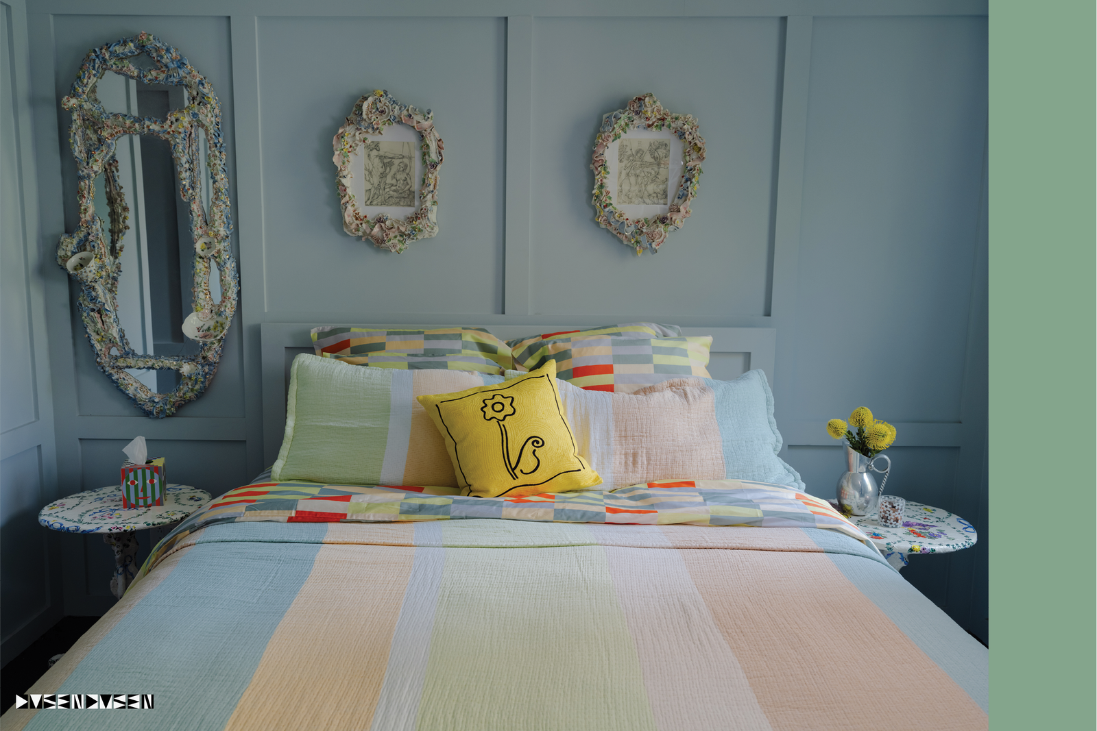 Meadow coverlet on bed with daisy pillow