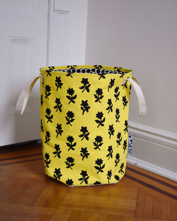 Marigold hamper on wooden floor