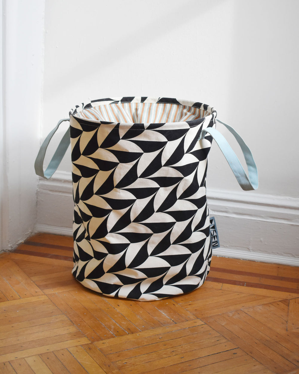 Scallop hamper on wooden floor