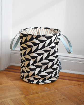 Scallop hamper on wooden floor