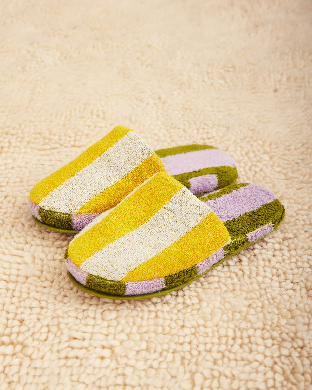 Dusen Dusen Stripe Slippers in Sea. Contrasting stripes and colorways on the outer shell and plush inner sole. 95% Cotton, 450gsm and 5% Polyamide/Nomex/Meryl. This item is Oeko-Tex Standard 100 certified (no harmful chemicals were used during production). Made in Portugal.