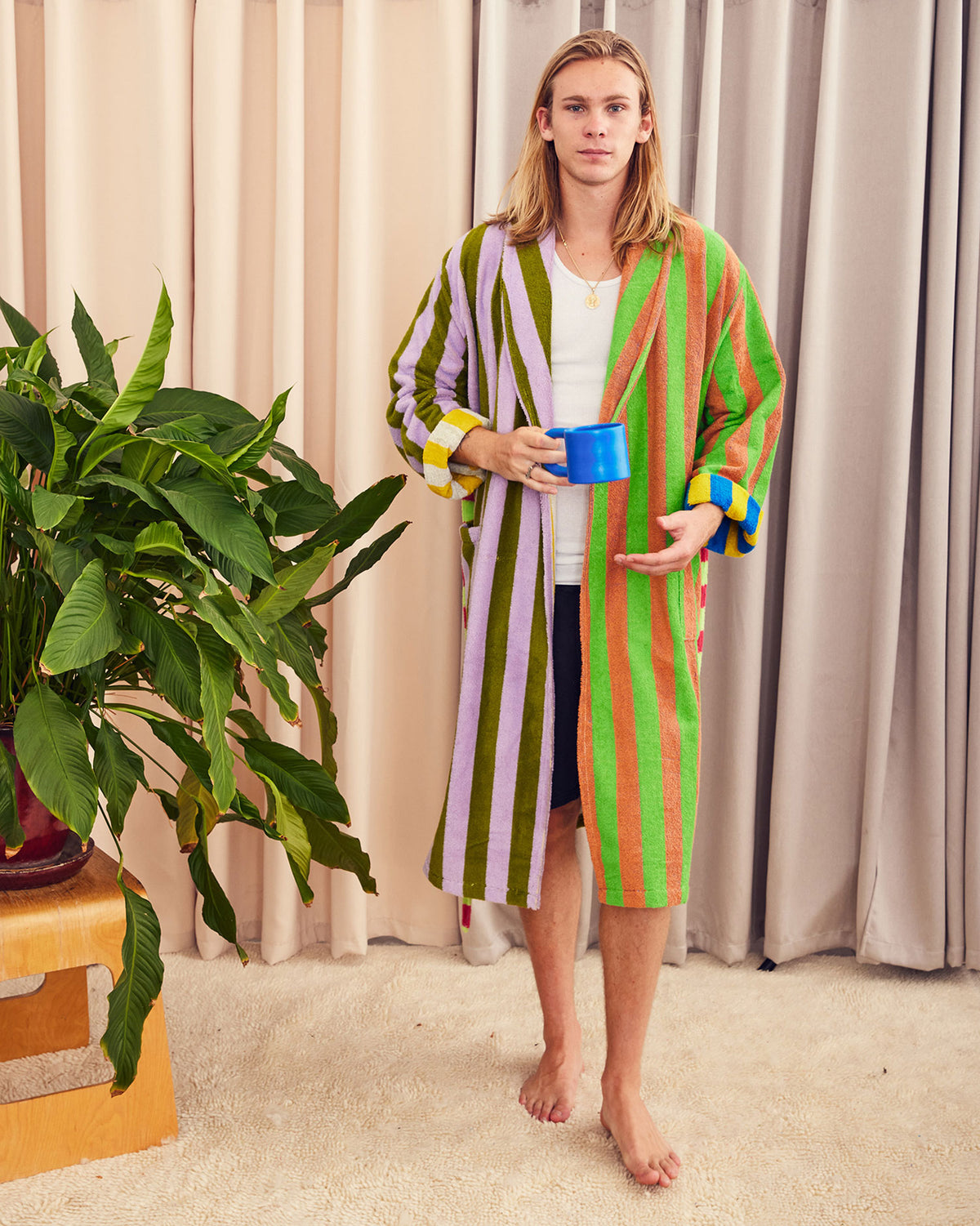 Bathrobe in Surf Stripe. Cotton terry bathrobe with shawl collar, patch pockets, and tie. Double contrasting stripes and colorways on both the outside and inside. 100% cotton terry, 450 gsm. This item is Oeko-Tex Standard 100 certified (no harmful chemicals were used during production). Made in Turkey.