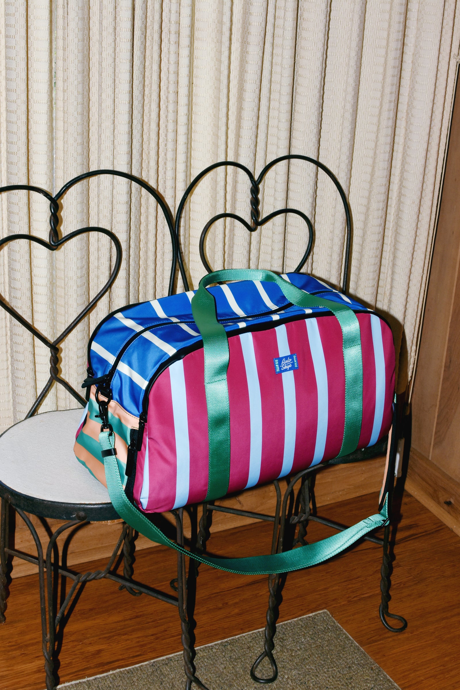 striped duffel on wire chair