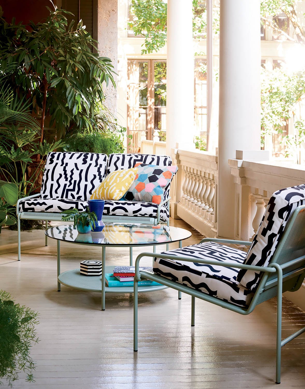 white chairs with black shapes patten on top