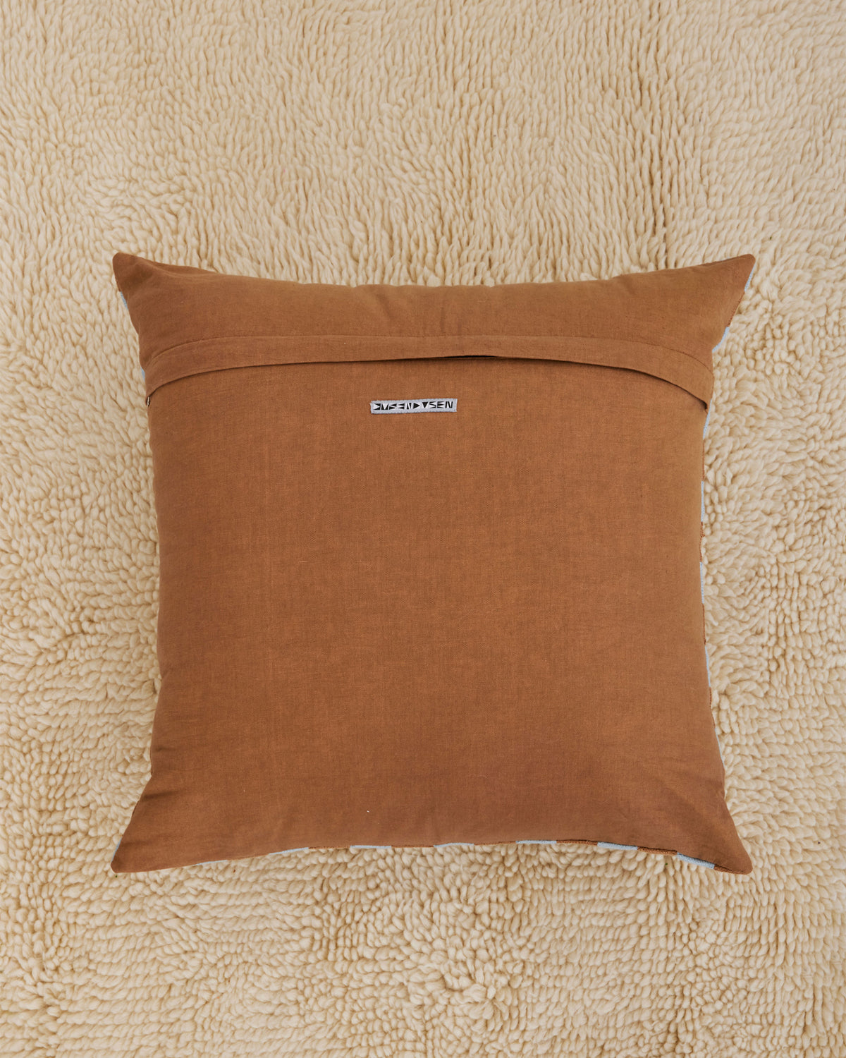 Dusen Dusen Basket Pillow. Basket pillow in multi-color check print. 100% cotton tufted pillow. Natural canvas back with zip closure. Available as 24" x 24". Spot clean only. Made in India.