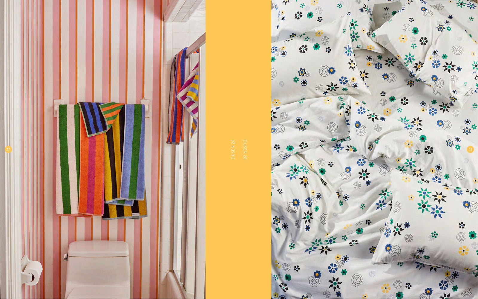 Striped towels in bathroom with pink wall paper and digital flower pattern on bedding from above