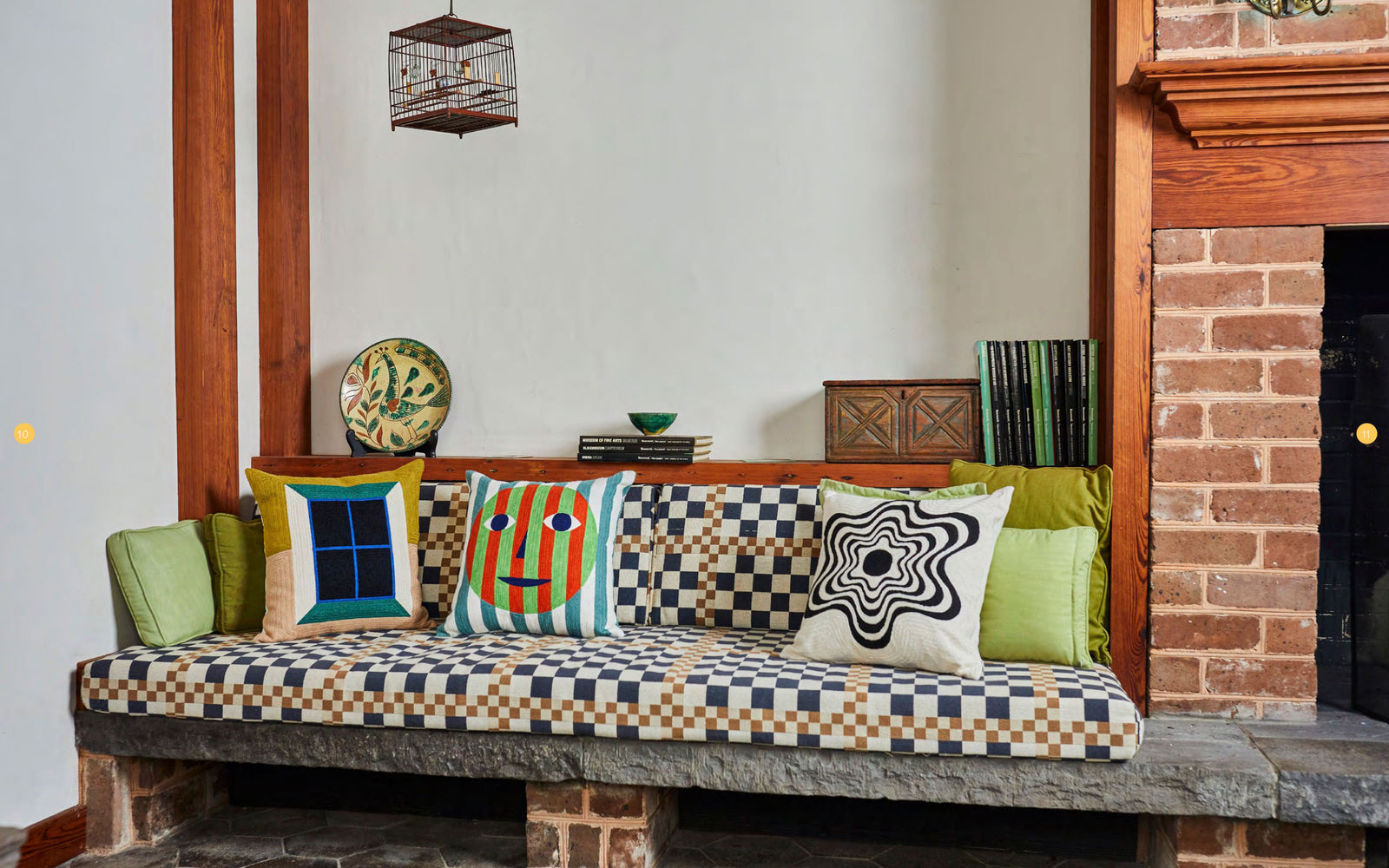 checkered couch with Window, Everybody Face and Flower pillow on it