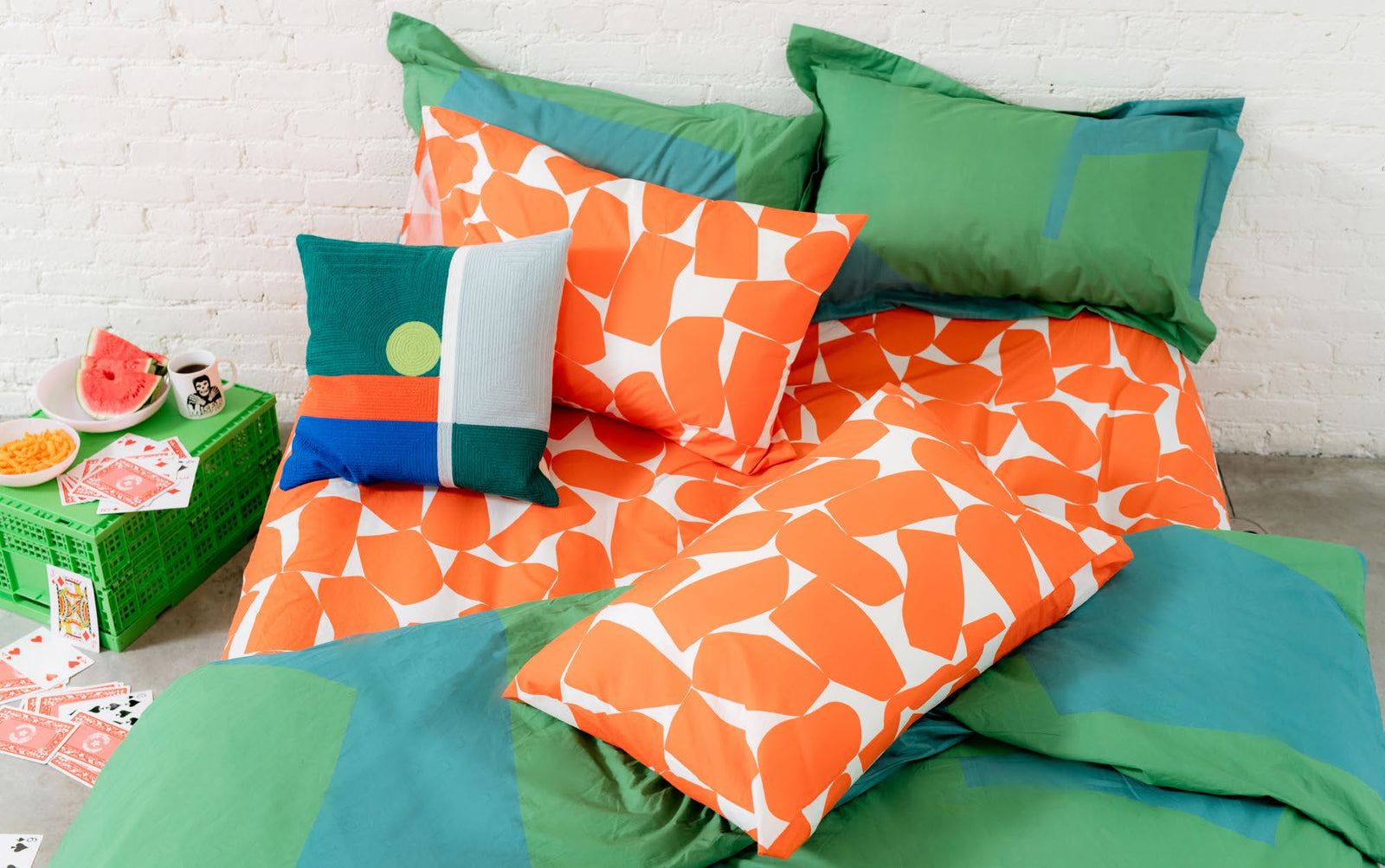 dot pillow, and orange bedding