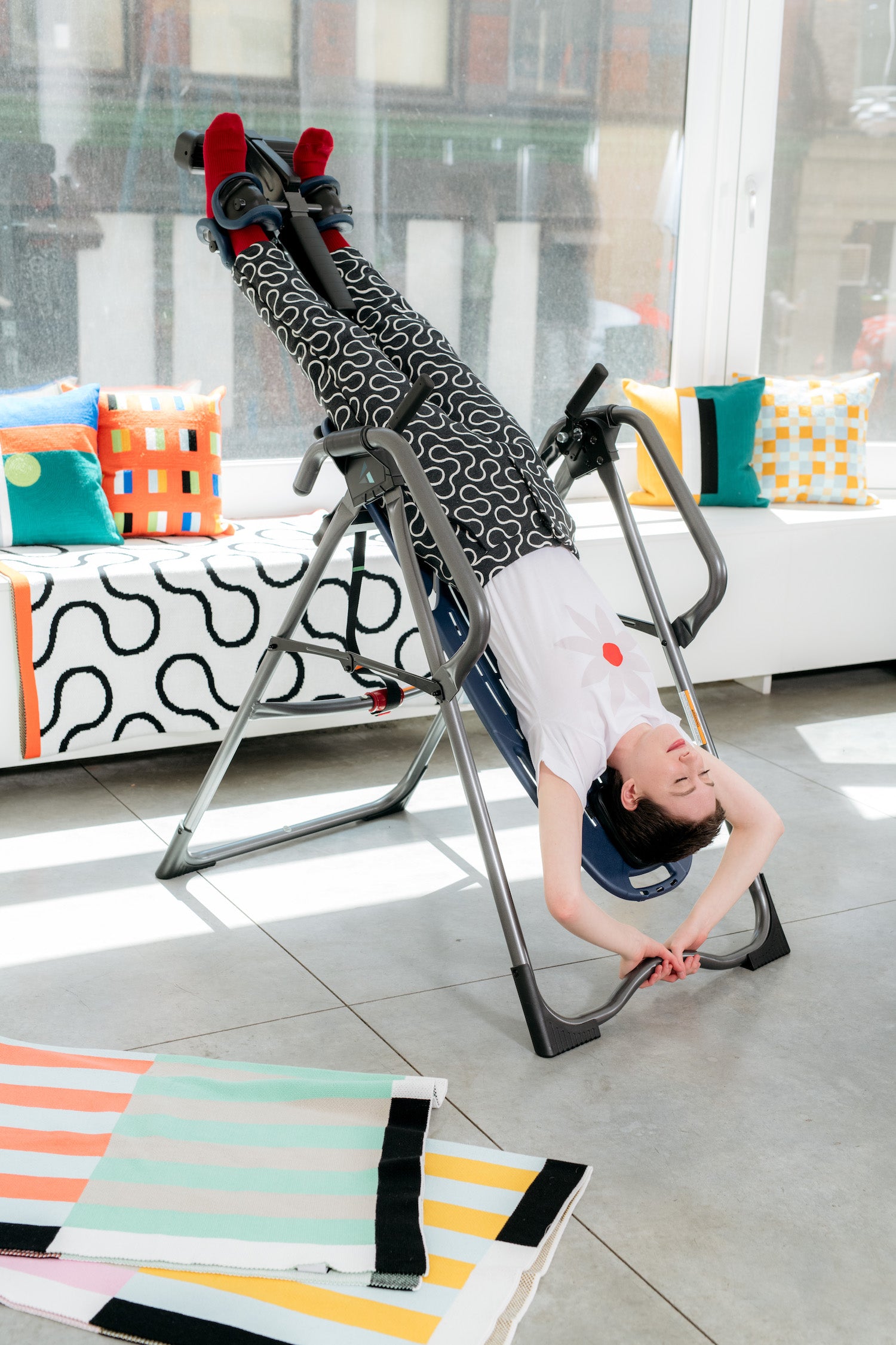 woman in arc pants upsidedown