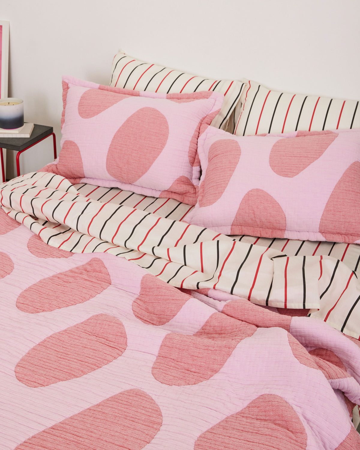 Dusen Dusen Egg Coverlet Set in dark and light pink Egg print. Woven matelassé coverlet with an inner layer of insulation for a quilted effect. Stone-washed, with an extra soft and gauzy hand feel.