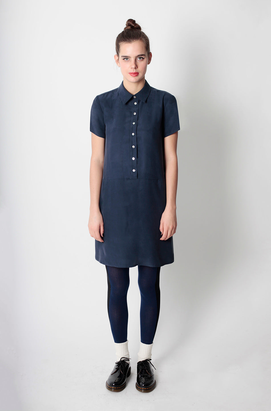 woman in button up navy shirt shift dress