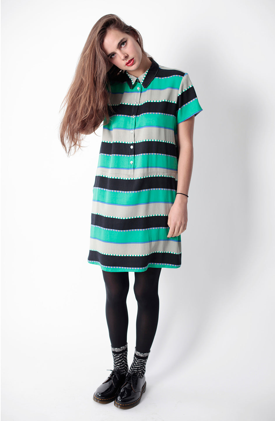 woman in green white and black stripe collared button up dess