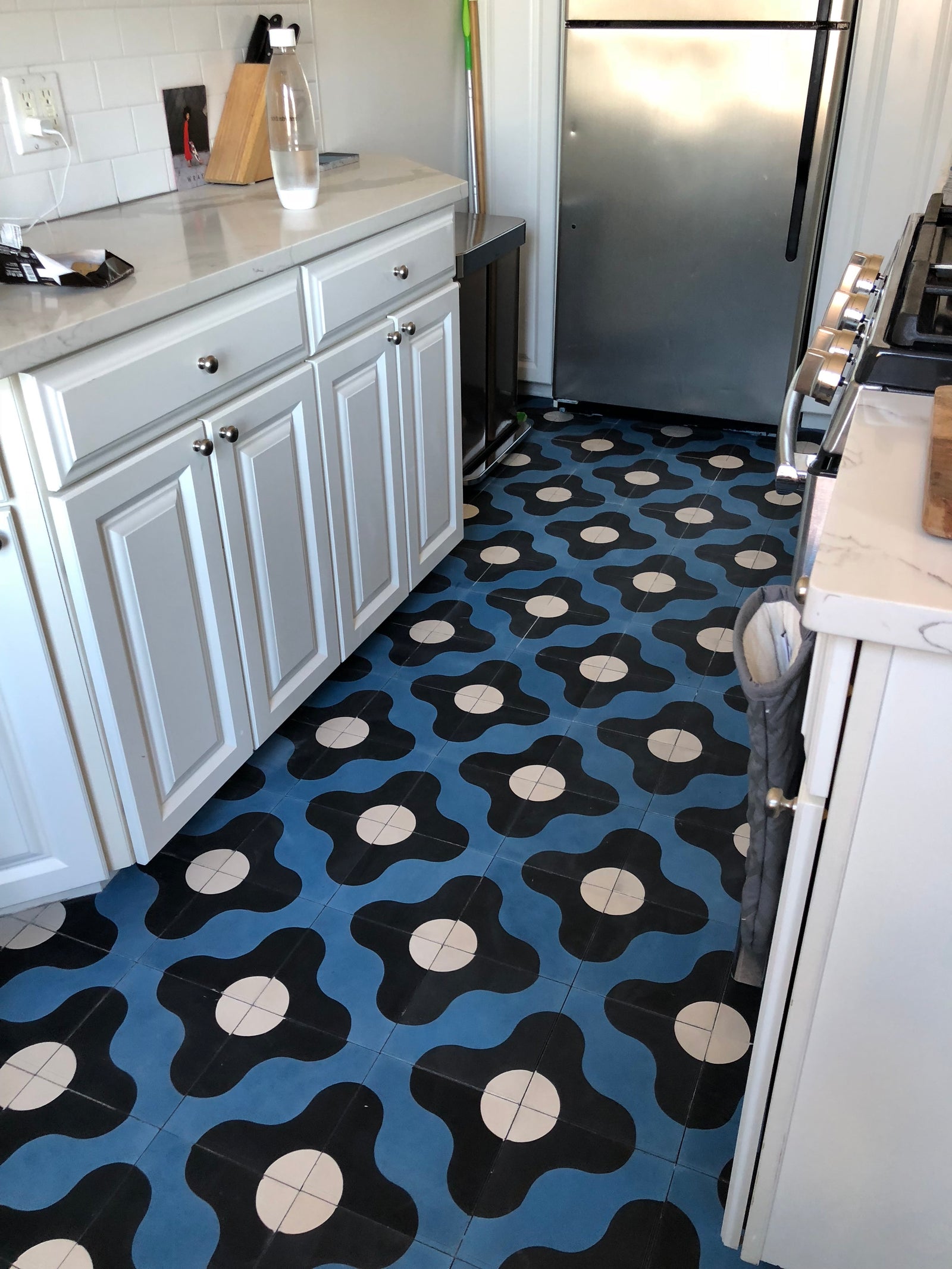 flower tiles in kitchen facing fridge