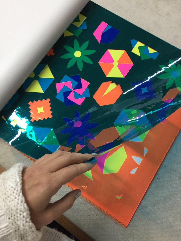 blue transparent sheet being lifted in a book