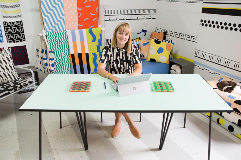 ellen at her desk