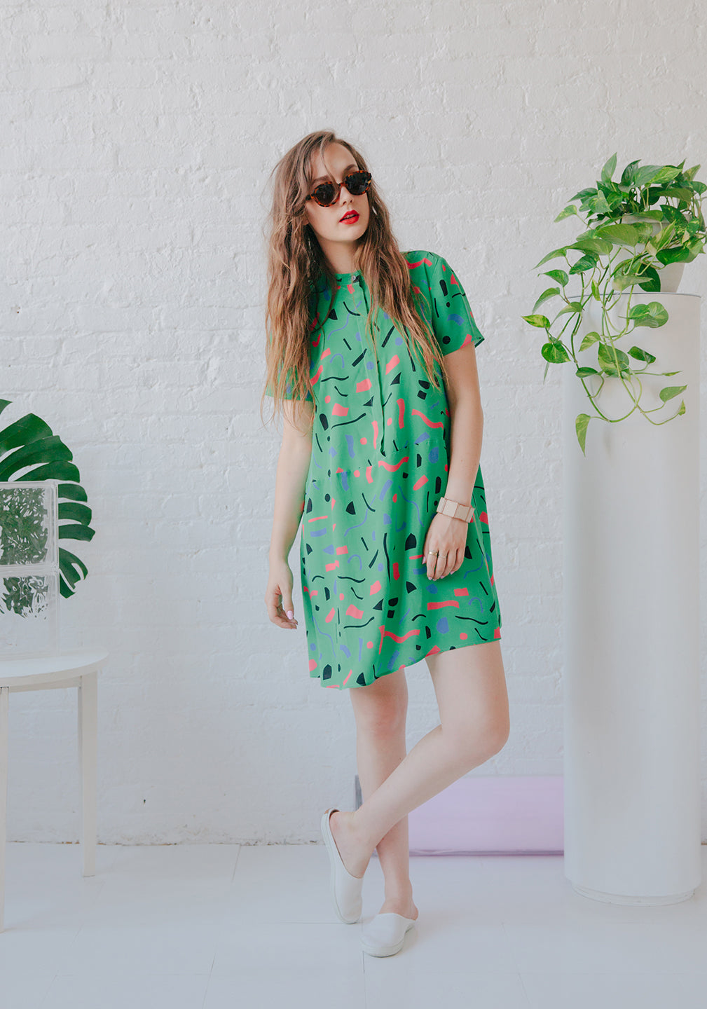 Woman in green dress with sunglasses