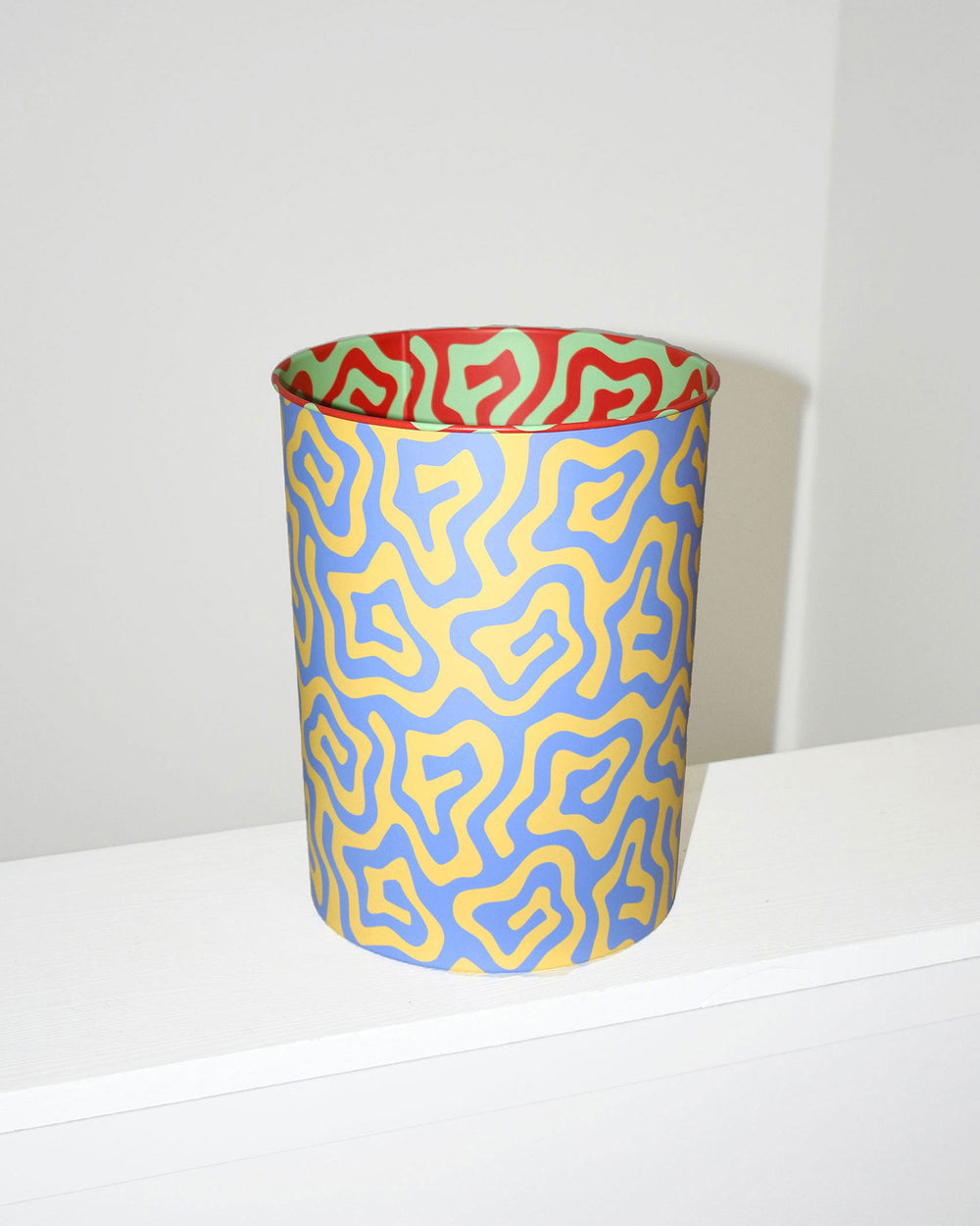 Spiral Pattern Bin. Patterned wastepaper bin made in collaboration with Areaware. Great for use in office or bathroom. 100% tin. 8.25 in x 10.5 in. Made in China. Not eligible for international shipping.