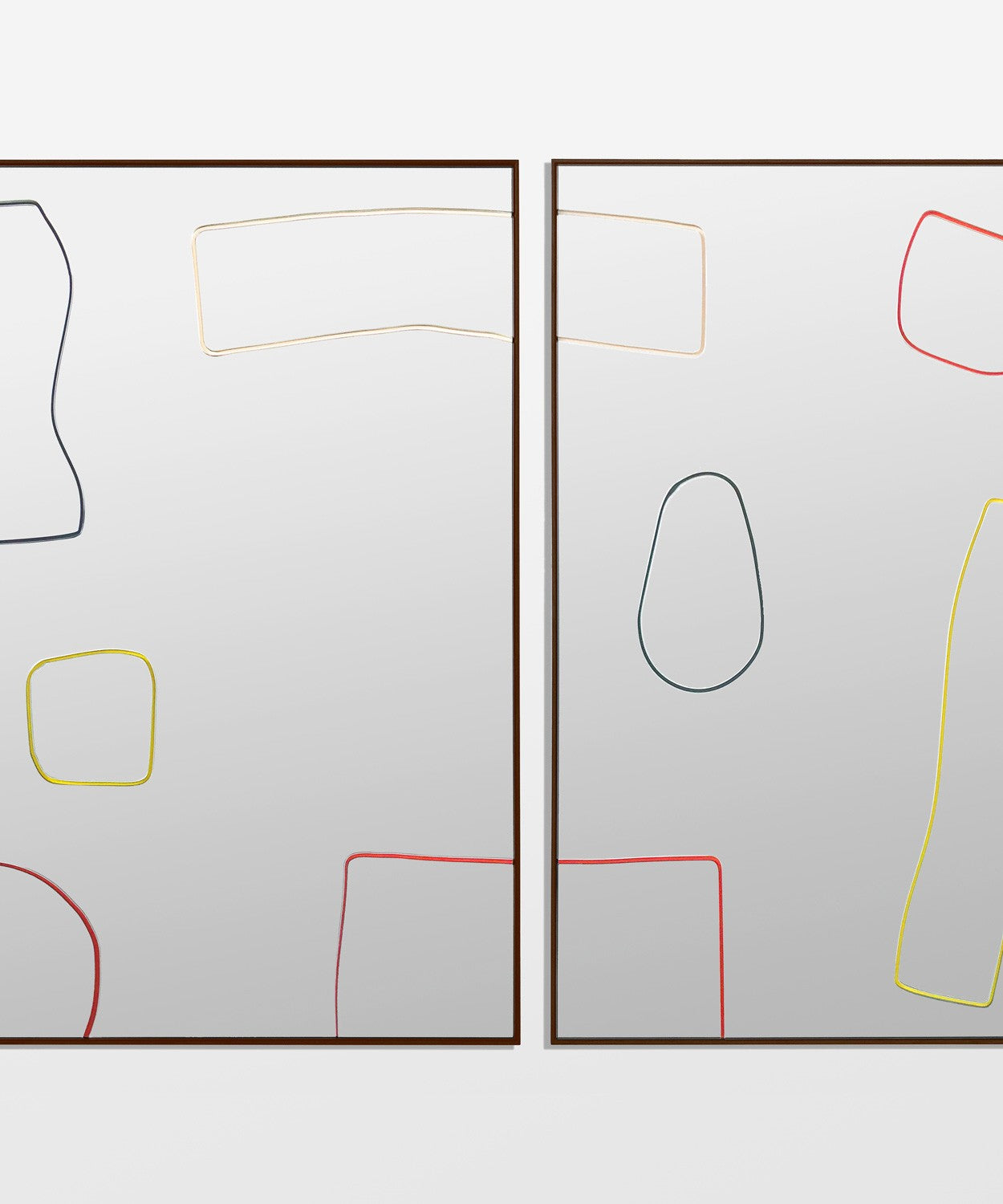Bower Cut out Mirror with outlines of different shapes on a square mirror with black frame.