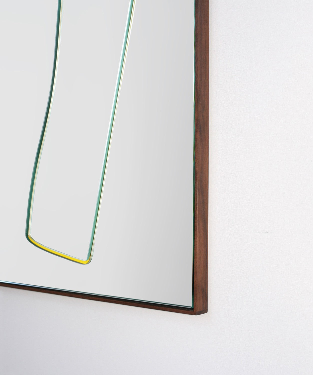 Bower Cut out Mirror with outlines of different shapes on a square mirror with black frame.