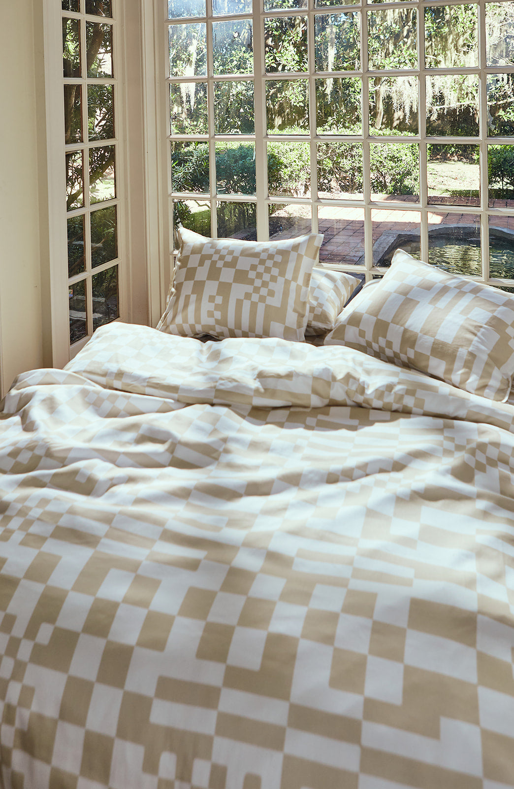 Dusen Dusen Check Duvet and Sheet Sets in beige and white Check print. Include an individual Flat Sheet to round out a Sheet Set. 100% cotton sateen, 300 thread count. Machine wash cold and tumble dry. Made in Portugal. Our cotton sateen is smooth and cool to the touch, and features a slight lustrous finish. The sateen softens further with every wash;