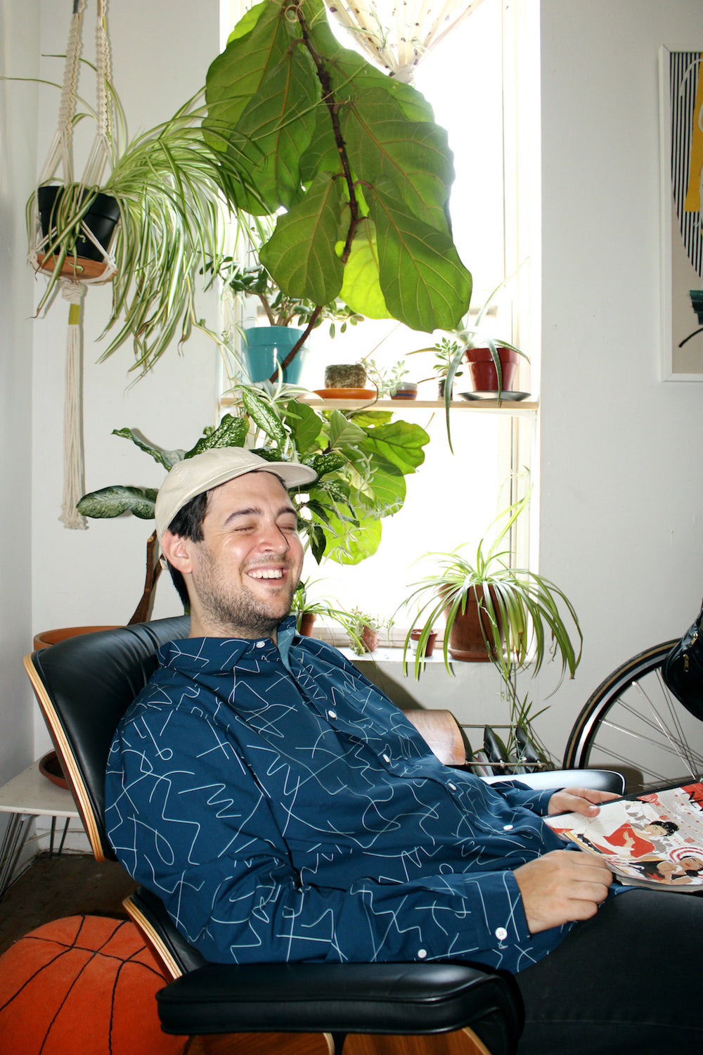 dave in eames chair in blue pattern button up