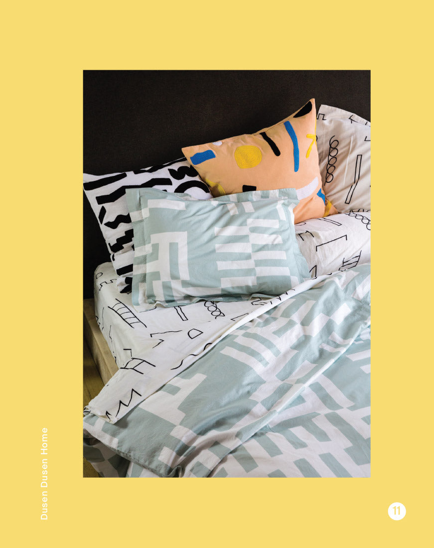greyblue sheets with black and white doodle sheets underneath
