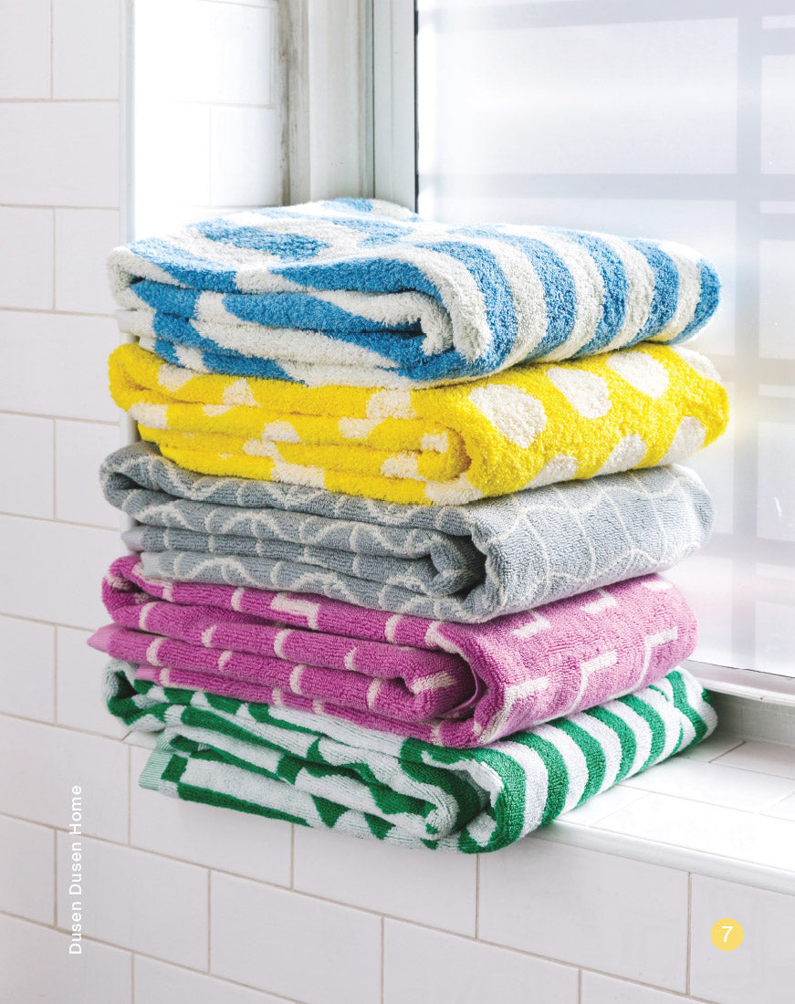 stack of colorful towels in window sill