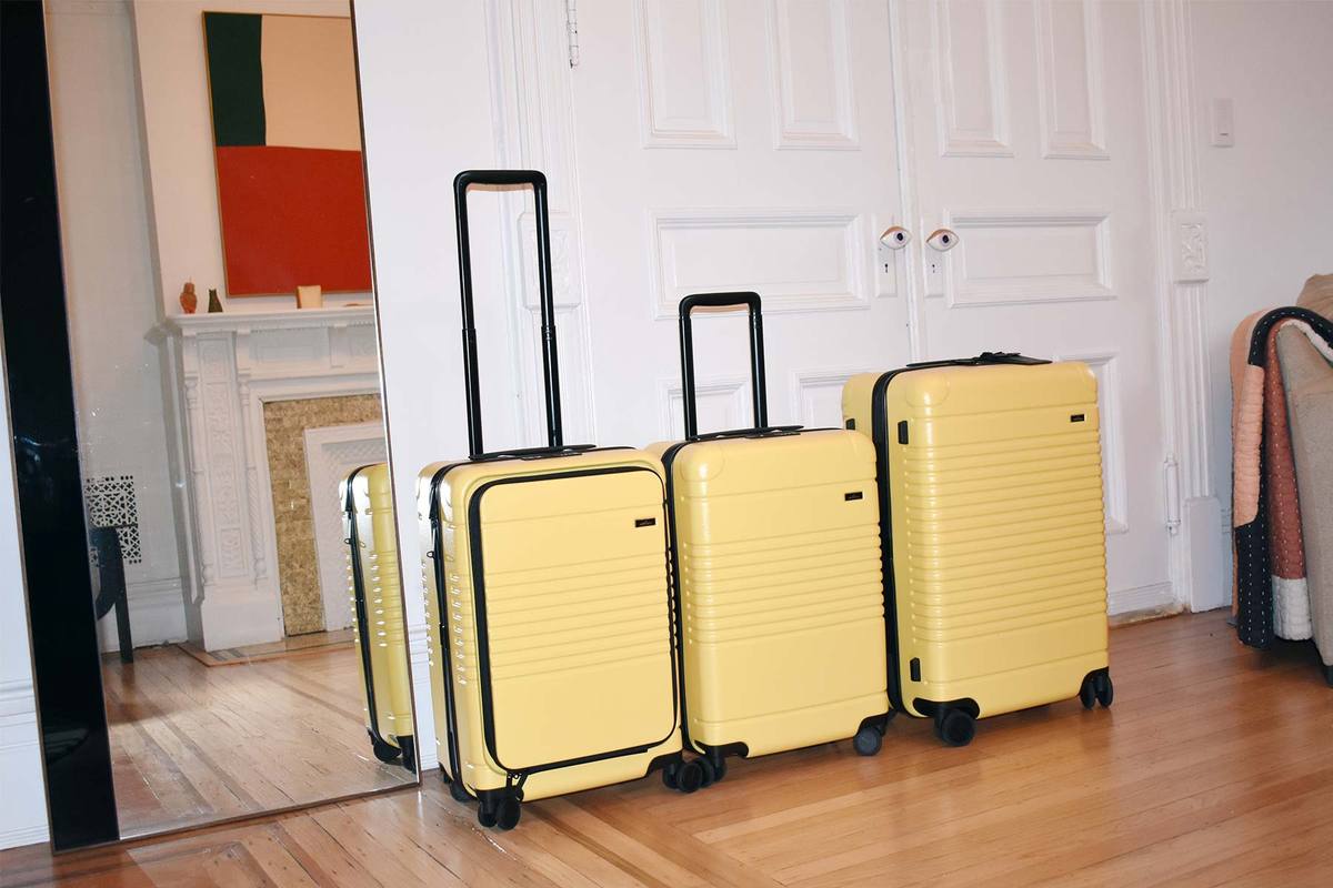 three yellow suitcases