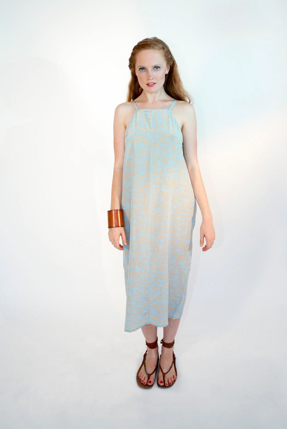 woman in halter strap sundress beige and baby blue