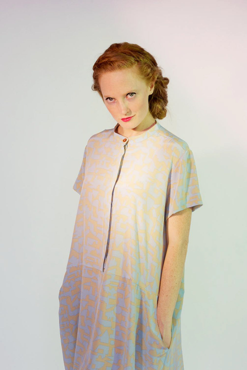 woman in button up pale blue and beige pattern