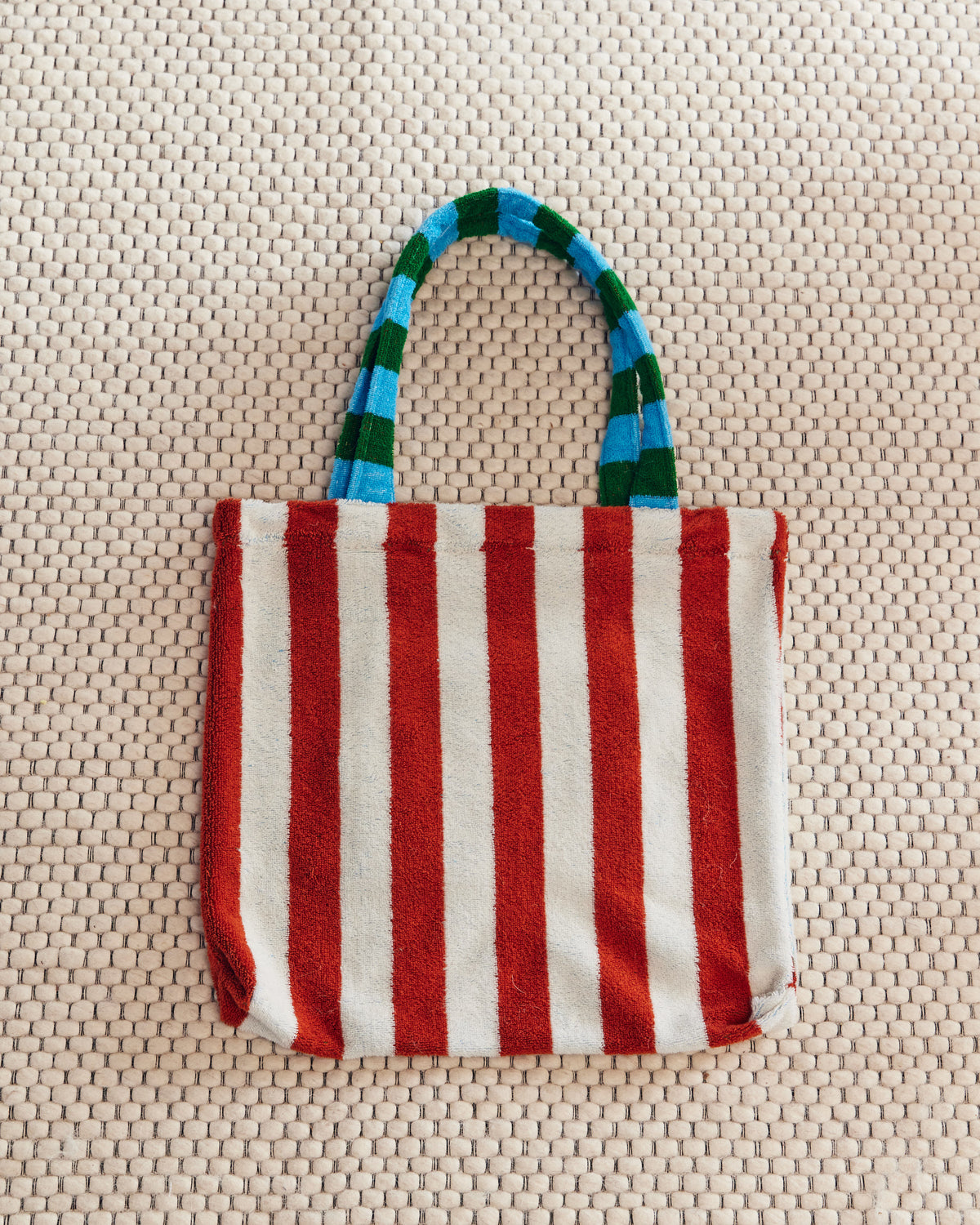 Brown and white, blue and green, this striped tote is peachy keen!