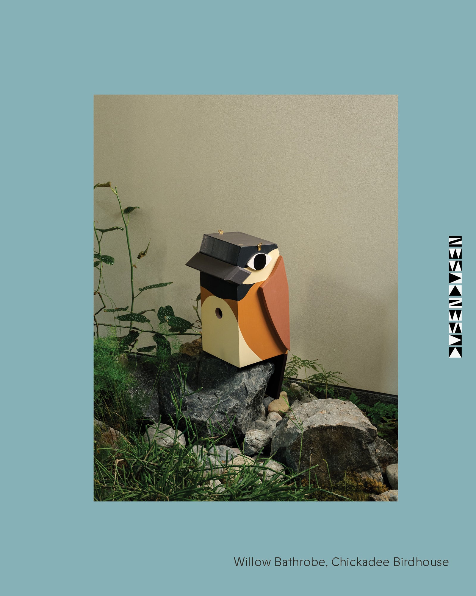 Birdhouse resembling a chickadee on a rock with a light blue border 