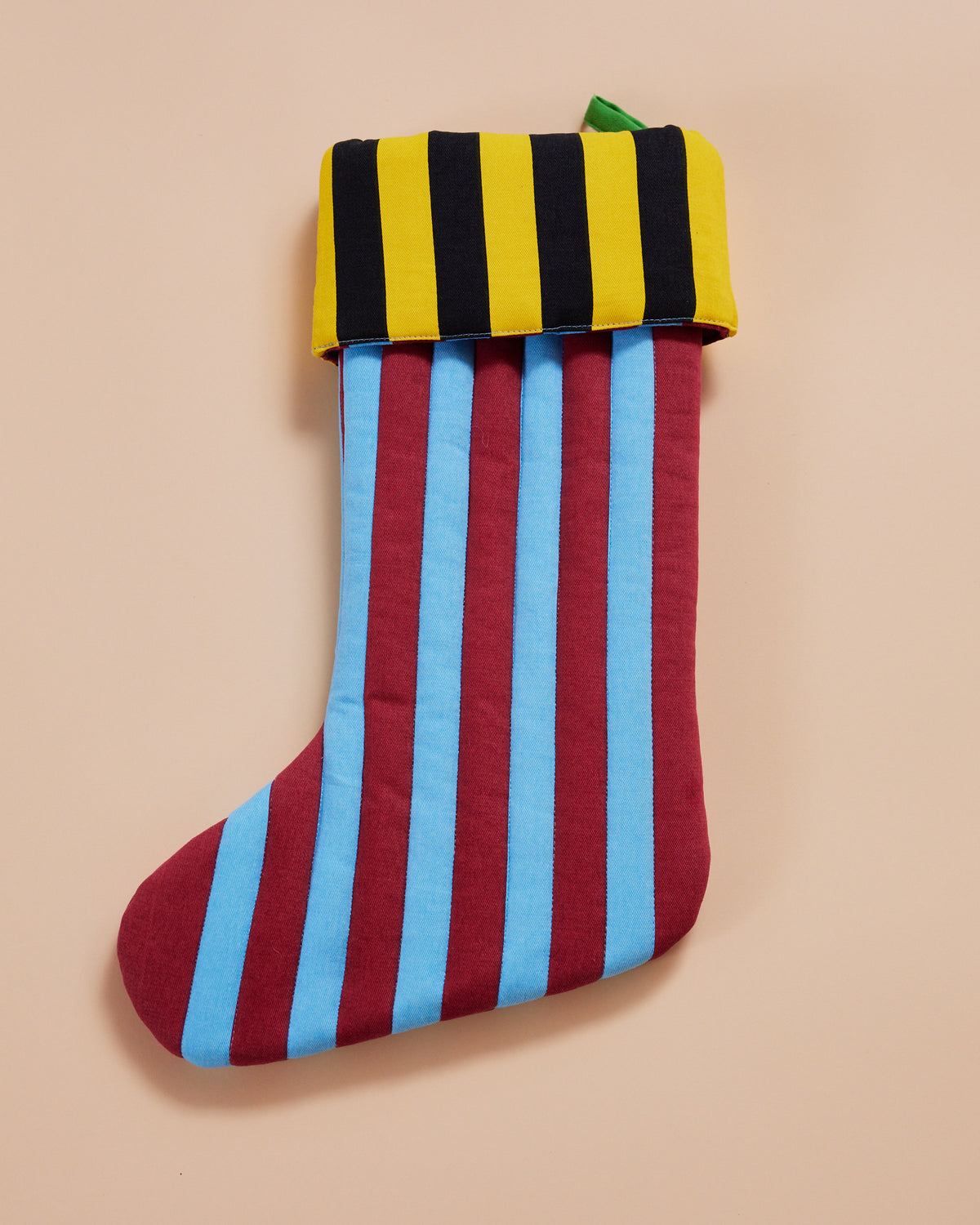 mustard stockng in yellow and black with blue and red stripes
