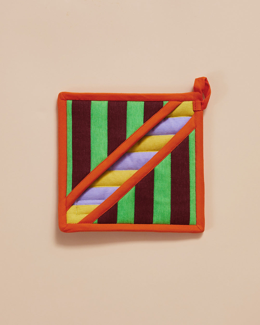 Dusen Dusen Stripe Pot Holder. Features a square pocket shape, top stitched brand label, and a side loop. 100% cotton quilted canvas base, with polyester fill. Stripe Pot Holder with contrast yellow, purple, green and Brown stripe pattern with an orange trim