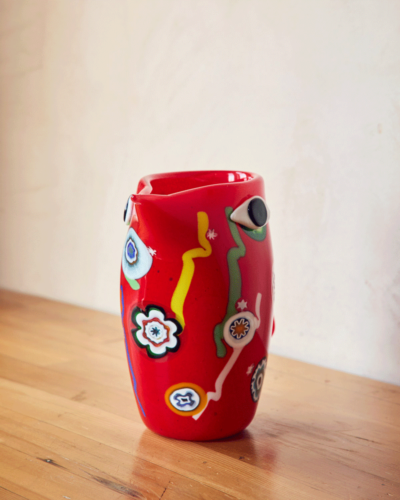 Red Murano pitcher with Murrine patterns spinning around