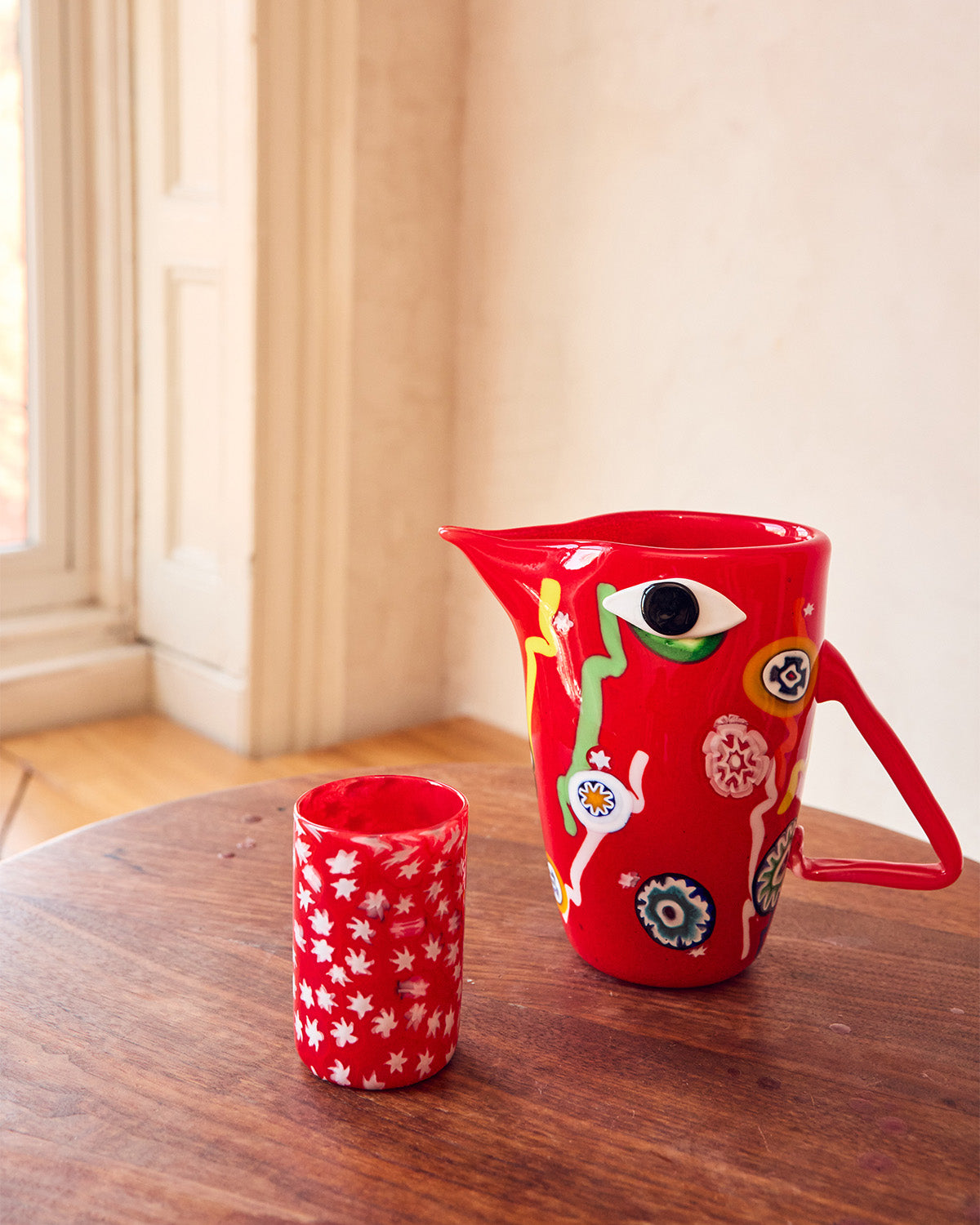 Red Murano pitcher with Murrine patterns with matching glass