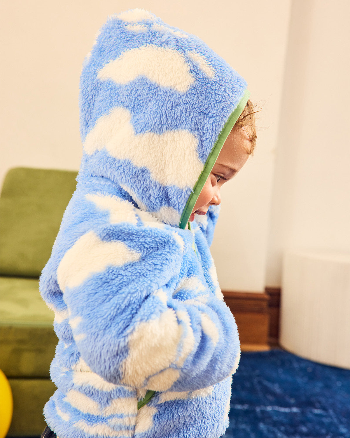 Cloud hoodie from the side with hood up over toddler's head