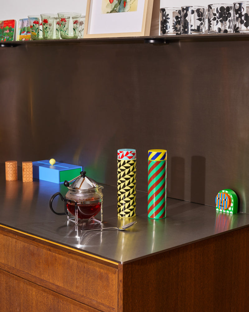 ["Scallop and Stripe bottle on counter with timer"]