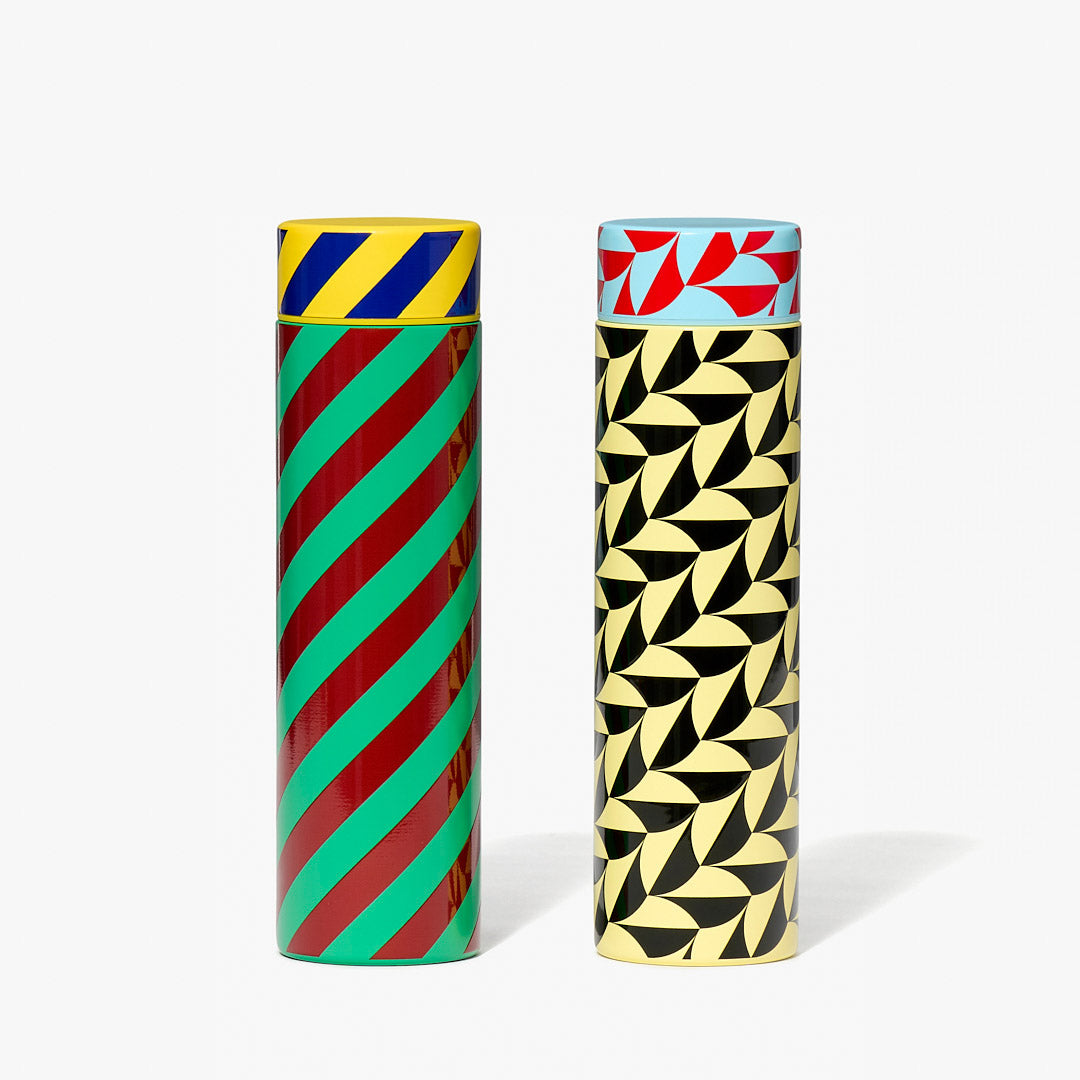 Stripe and Scallop bottles next to one another white background