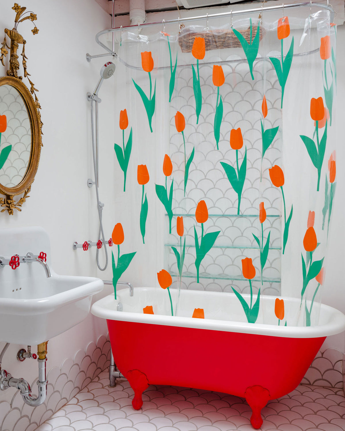 Dusen Dusen Tulip Shower Curtain. Red tulip petals with green stems printed on clear background. Embossed logo in bottom corner. 100% PEVA free of PVC and BPA. 12 anti-rust stainless steel grommets.